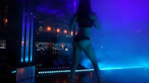Dancer Arianna works the Stripper Pole with our new blue lasers doing their magic
